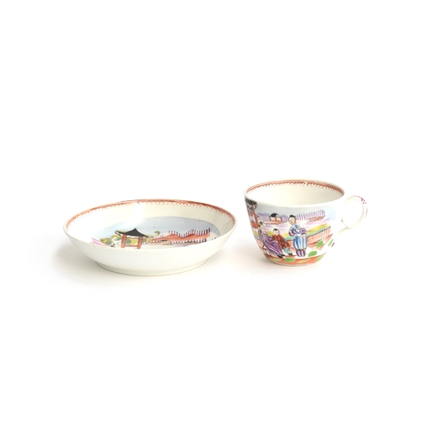 237 - A New Hall teacup and saucer, in a rare 1172 pattern Mandarin family scene, c.1820, New Hall mark to... 