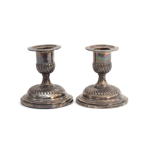 144 - A pair of Victorian silver dwarf candlesticks by Horace and Woodward & Co. Ltd, London 1885, the cam... 