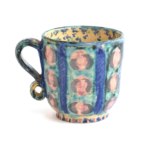 240 - A Fulham Pottery mug by Vicky Walton, possibly designed by Quentin Bell, with applied scroll handle,... 