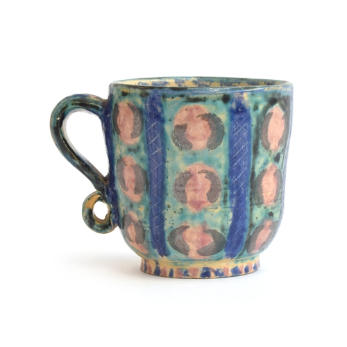 240 - A Fulham Pottery mug by Vicky Walton, possibly designed by Quentin Bell, with applied scroll handle,... 