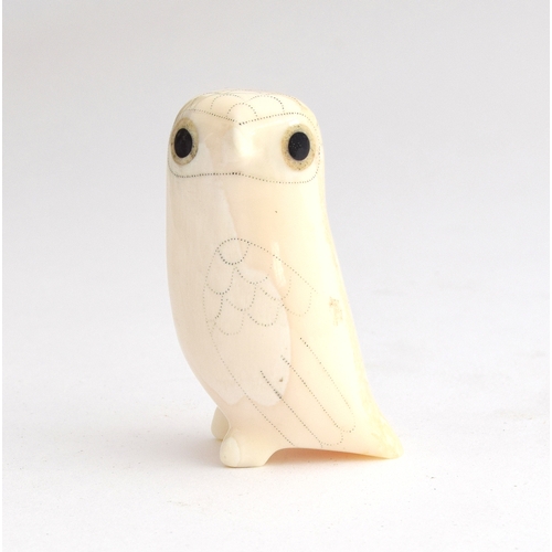 170 - Donald Ungott (1935-2002), an owl figurine caved from walrus tusk with double inlaid eyes, 5.5cm hig... 