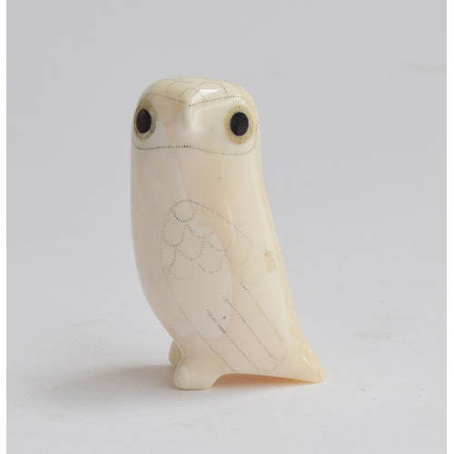 170 - Donald Ungott (1935-2002), an owl figurine caved from walrus tusk with double inlaid eyes, 5.5cm hig... 