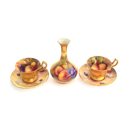 225 - A Royal Worcester bottle vase, hand painted with fruit, signed A. Shuck, 14cm high; together with a ... 