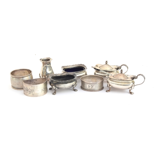 91 - A silver cruet set by Gladwin Ltd, Birmingham 1941, one glass liner and lid of pepper missing; and t... 