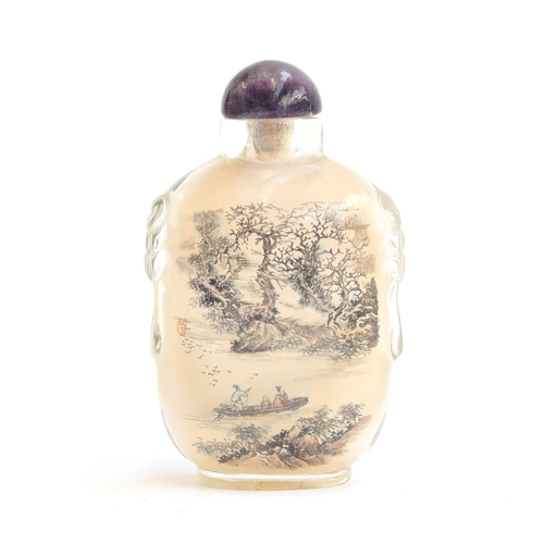 184 - A Chinese inside painted carved rock crystal snuff bottle with amethyst stopper, one side depicting ... 