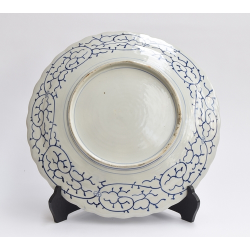 203 - A large Chinese export blue and white charger, profuse floral decoration, 44cm diameter