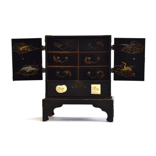 187 - A Japanese Meiji era lacquered kodansu table cabinet and stand, inset with six Satsuma porcelain pla... 