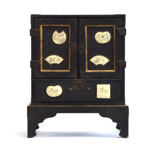 187 - A Japanese Meiji era lacquered kodansu table cabinet and stand, inset with six Satsuma porcelain pla... 