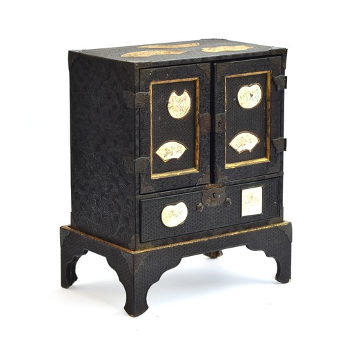 187 - A Japanese Meiji era lacquered kodansu table cabinet and stand, inset with six Satsuma porcelain pla... 