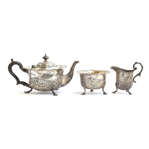 99 - An Edwardian chased silver teapot and sugar bowl by George Nathan & Ridley Hayes, Chester 1904 and 1... 