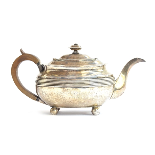 95 - A George III silver teapot by Solomon Hougham, London 1809, of banded oblong form, on ball feet, 17.... 