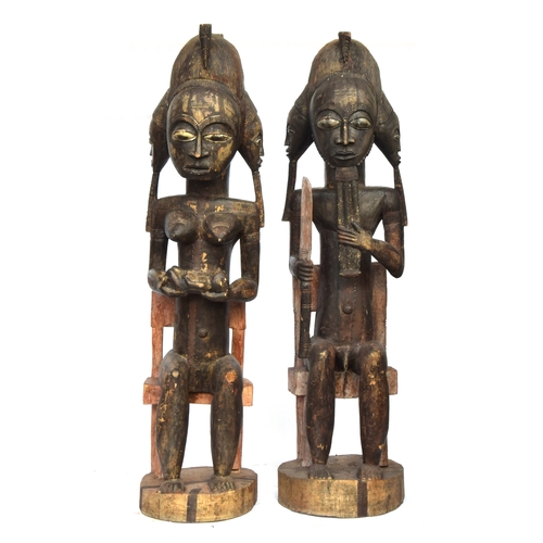 694 - A pair of Senufo seated fertility figures, carved wood, Ivory Coast, 200cm high

PLEASE NOTE THAT FO... 