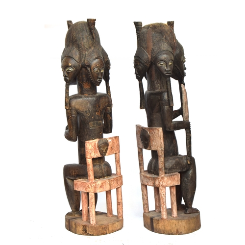 694 - A pair of Senufo seated fertility figures, carved wood, Ivory Coast, 200cm high

PLEASE NOTE THAT FO... 