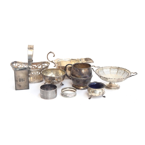 63 - A mixed lot of silver items to include a George V gravy boat by Robert Pringle & Sons, Birmingham 19... 