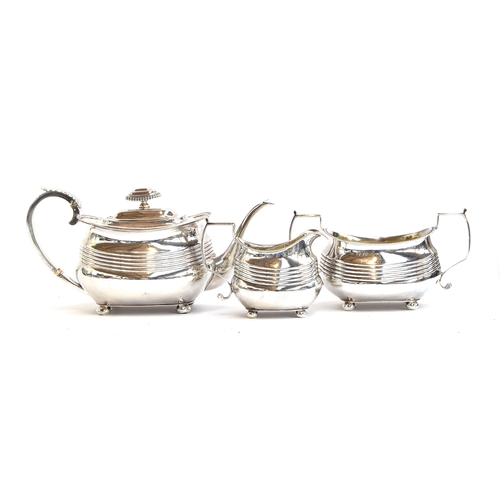 98 - A three piece silver teaset by Thomas & George Hayter, London 1817, of banded rectangular form, the ... 