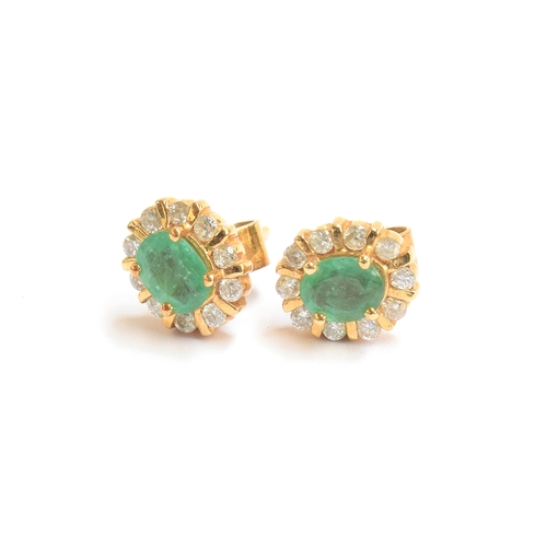 12 - A pair of 18ct gold, emerald and diamond stud earrings, 0.7cm long, gross weight 3.2g