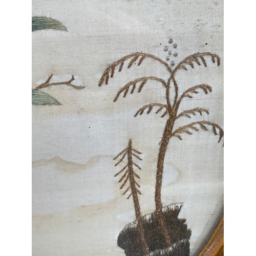 285 - A Georgian silk picture of a parrot perched on a branch, in a gilt gesso frame, 38x34cm