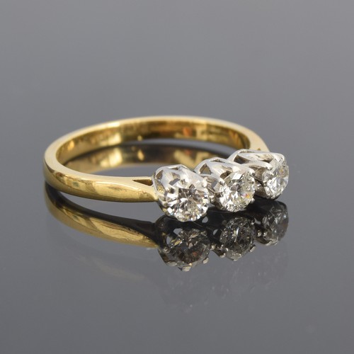 An 18ct gold and diamond trilogy ring, total carat weight approx. 0.75ct, size R, 4g