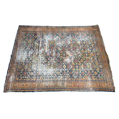 720 - A very large Persian Malayer rug, interlocking florals on a blue ground, 515x380cm