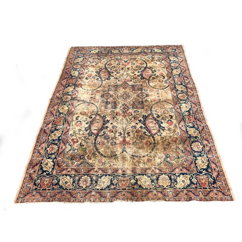 731 - A large antique Persian Isfahan rug, large scrolling vines surround a central medallion, 296x403cm