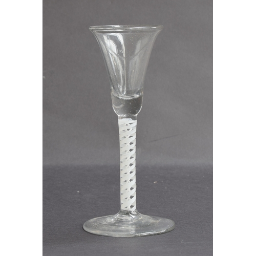 259A - A mid-18th century cordial glass, opaque twist stem on folded foot, 16cm high