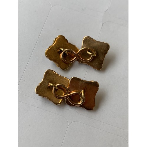 25 - A pair of early 19th century gold and enamel cufflinks, test as 15ct or higher, with square chased b... 