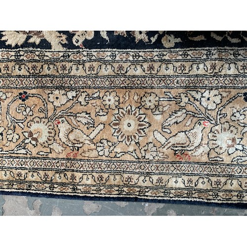 716 - Persian silk Qum rug, animals among foliage, 211x141cm