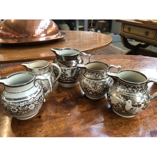 236 - A collection of fifteen 19th century silver lustre jugs, of varying sizes, approximately 11.5cm to 1... 