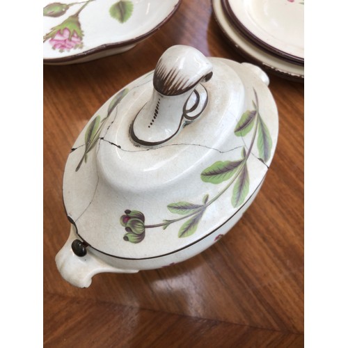 229 - A Davenport pearlware botanical dessert service, each piece hand painted with a flower within brown ... 