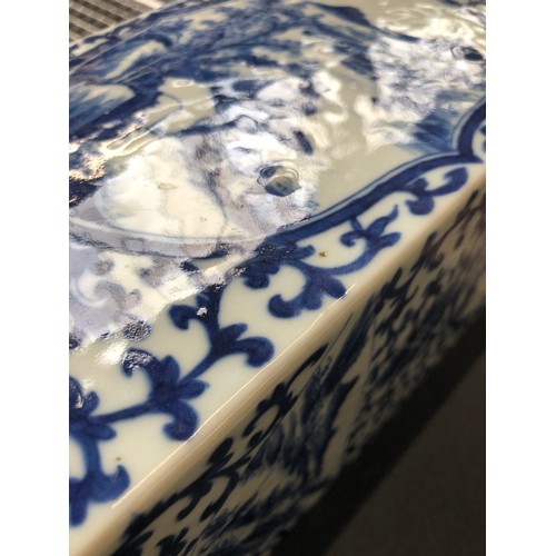 208 - A pair of tall Chinese blue and white vases of square form, each of the four sides painted with pane... 