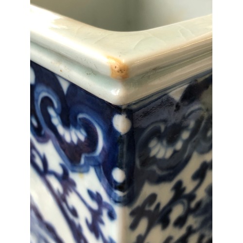 208 - A pair of tall Chinese blue and white vases of square form, each of the four sides painted with pane... 