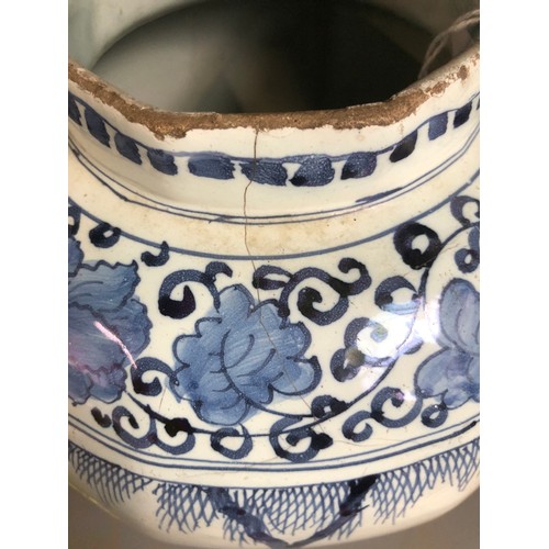 209 - An 18th century Delft vase, blue and white in the Chinese Transitional style, octagonal rim, decorat... 