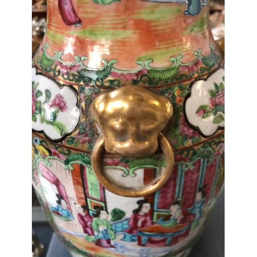 196 - A large 19th century Chinese famille rose vase, decorated with panels depicting court scenes and flo... 