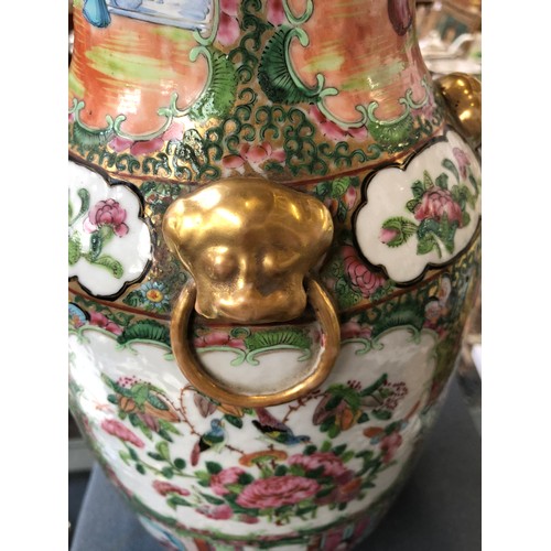 196 - A large 19th century Chinese famille rose vase, decorated with panels depicting court scenes and flo... 