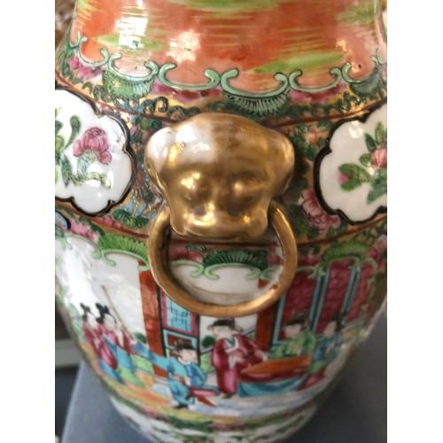 196 - A large 19th century Chinese famille rose vase, decorated with panels depicting court scenes and flo... 