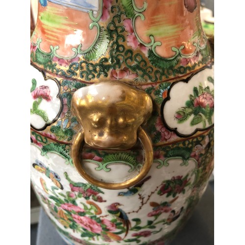 196 - A large 19th century Chinese famille rose vase, decorated with panels depicting court scenes and flo... 