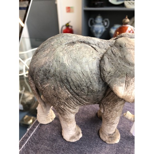 173 - Nick Mackman (b.1972), a raku sculpture of a baby elephant, incised signature to leg, 13.5cm high