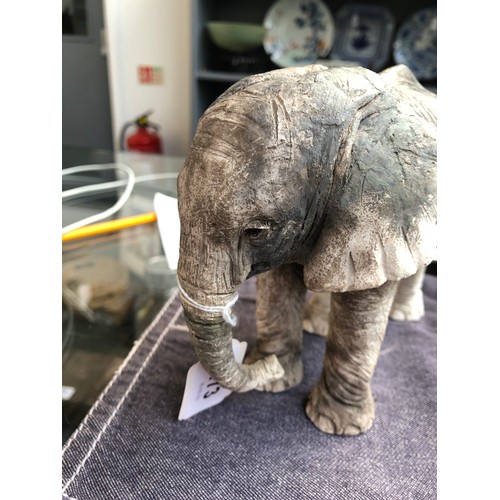 173 - Nick Mackman (b.1972), a raku sculpture of a baby elephant, incised signature to leg, 13.5cm high