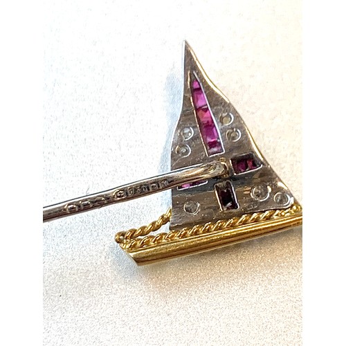 10 - An 18ct white and yellow gold, diamond and calibre cut ruby Royal Yacht Squadron stick pin, 1.5cm wi... 