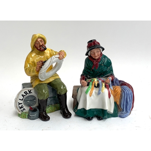 124 - Two Royal Doulton figures: The Boatman HN2417 signed to base by Michael Doulton and dated 1979; toge... 