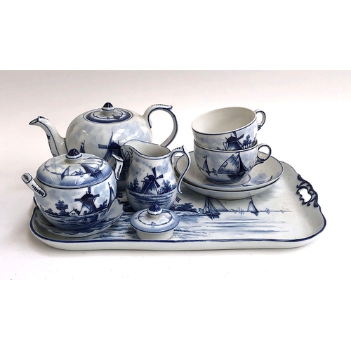 89 - A Delft blue and white tea service, comprising teapot, cups, saucers, tray etc