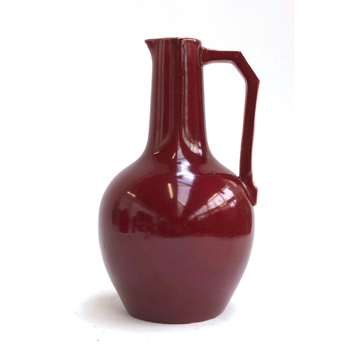 109 - Christopher Dresser for Lear Pottery, a late 19th century Sang de Bouef glaze jug c.1880, 26cmH