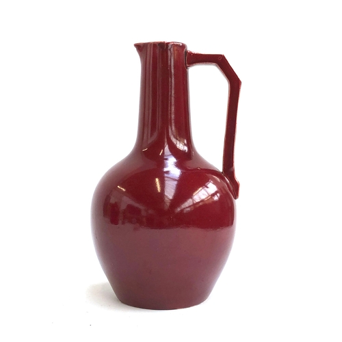 109 - Christopher Dresser for Lear Pottery, a late 19th century Sang de Bouef glaze jug c.1880, 26cmH