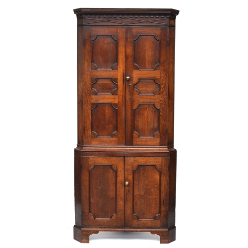 794 - A George III oak standing corner cupboard, approx. 95cm wide, 213cm high