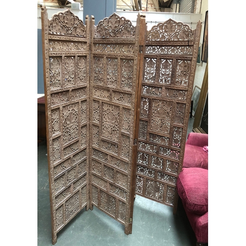 779 - A pierced and carved Indian hardwood four fold screen, each section 51x184cm