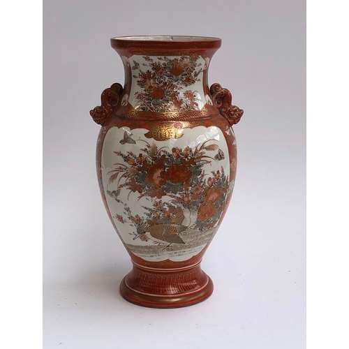 65 - A Japanese kutani twin handled vase, depicting birds and foliage, 36cm high