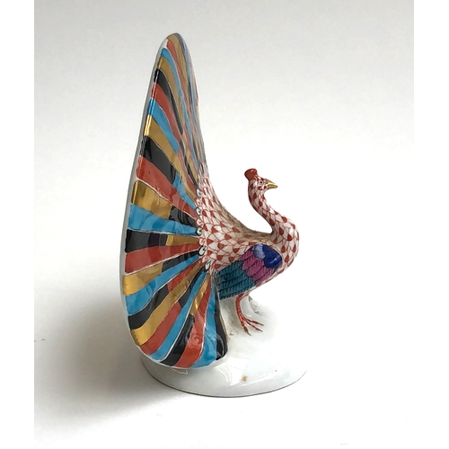 62 - A ceramic hand painted Herend peacock, 11cm high