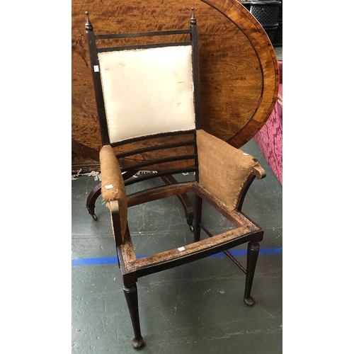 766 - An Arts and Crafts armchair, in need of re-upholstry, 63cmW