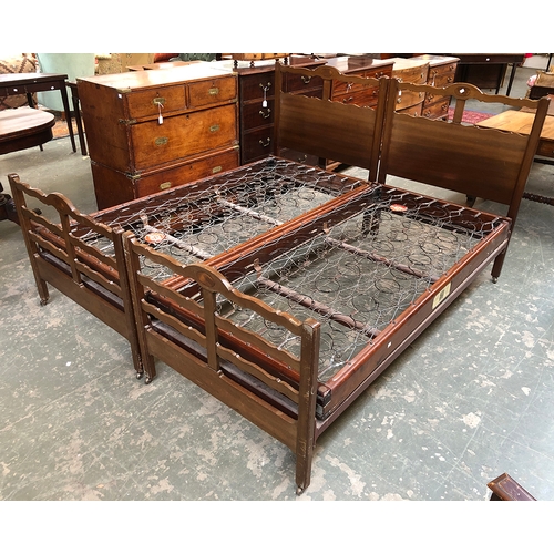 780 - A pair of 20th century mahogany single beds by Heal & Son ltd, each with Staples mattress frames and... 