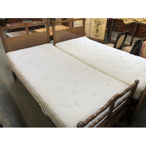 780 - A pair of 20th century mahogany single beds by Heal & Son ltd, each with Staples mattress frames and... 